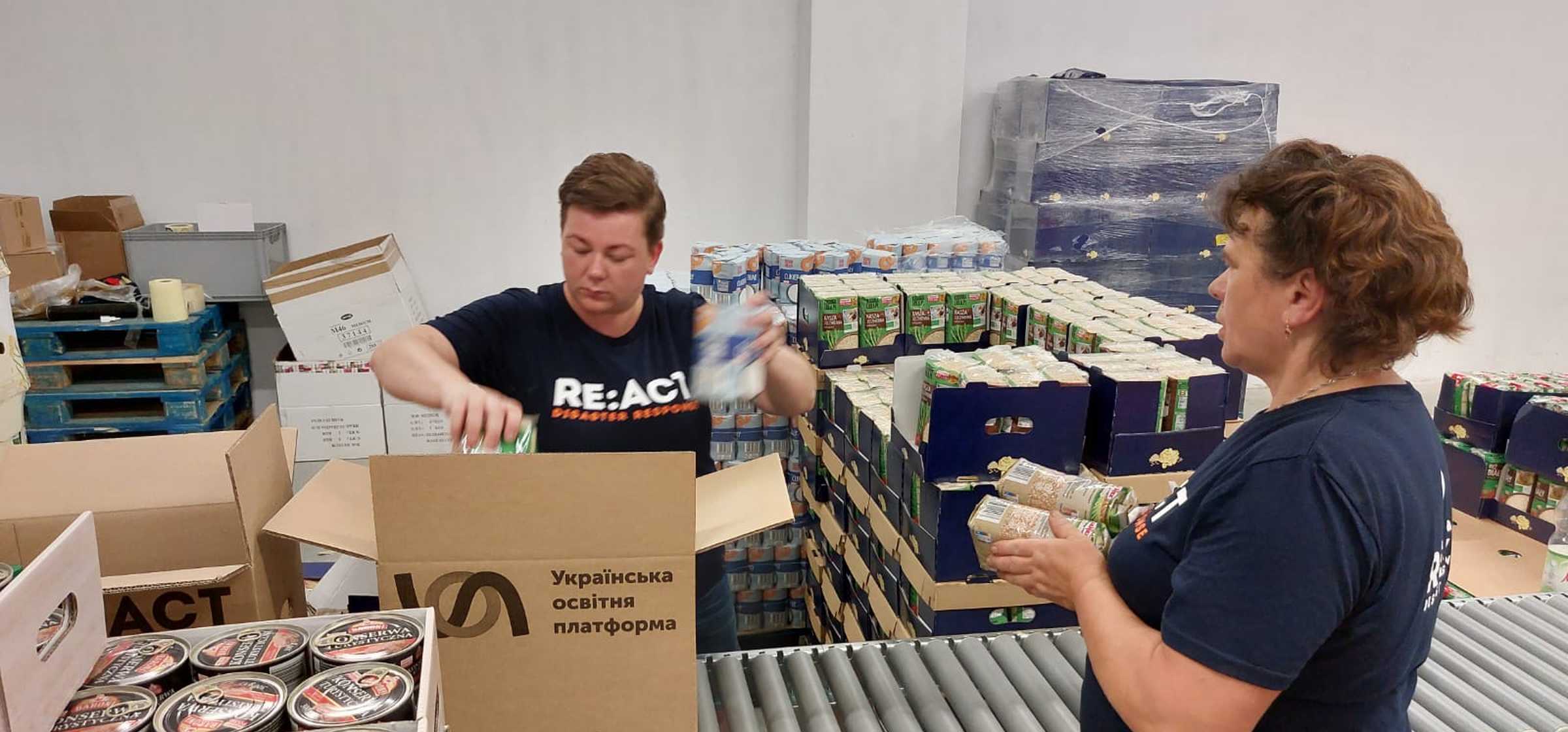 Preparing family food packs at Przemysl Warehouse in Poland - July 2022.jpg